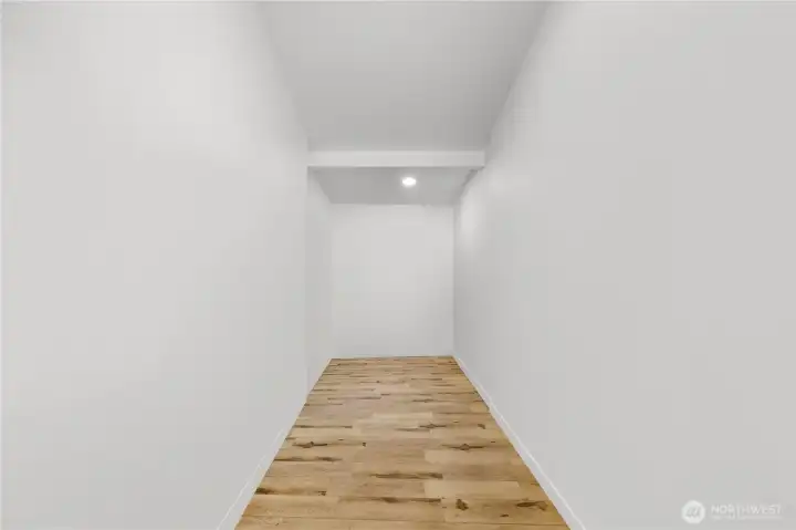 Walk in closet,  personal items have been digitally removed.