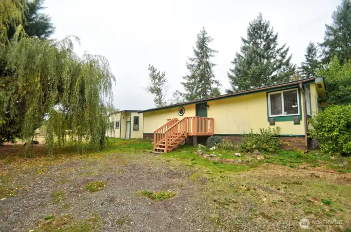 Home and shop on large lot! Backs to greenbelt.