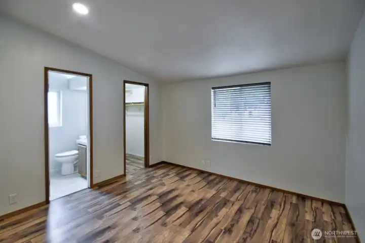 Primary Suite with full bath and walk-in closet.