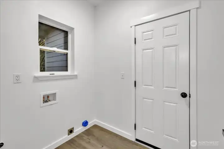 Entry from garage into laundry room.
