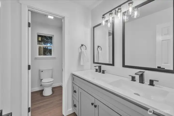 Upstairs guest bathroom with tub & shower.