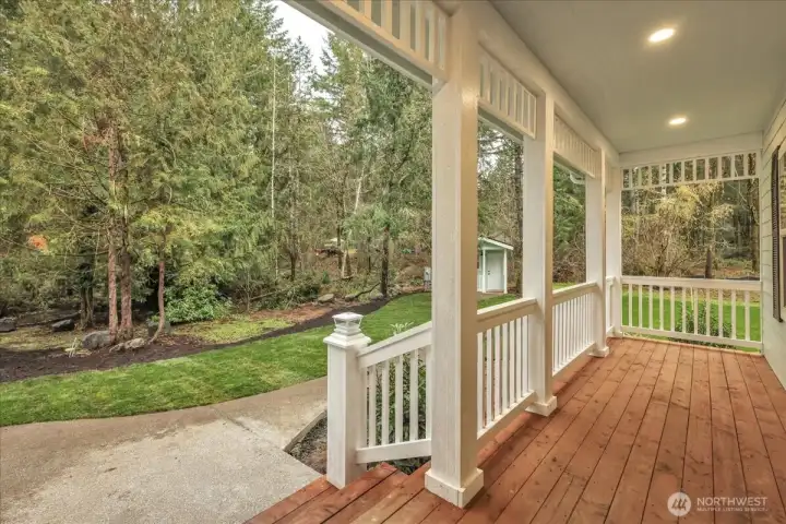 view exiting the front door of the home under the covered porch.