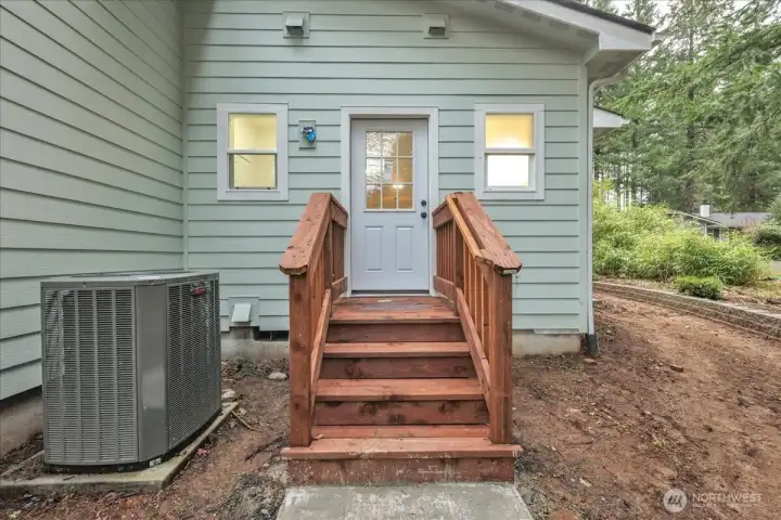 Entry on side of home to laundry/kitchen area.  Heat pump!