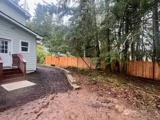 Newly added fence across the back of the property.