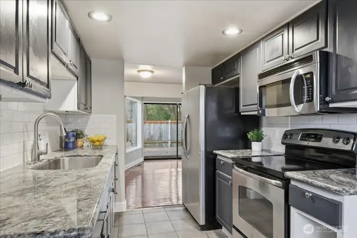 Kitchen with Slab Granite Counters