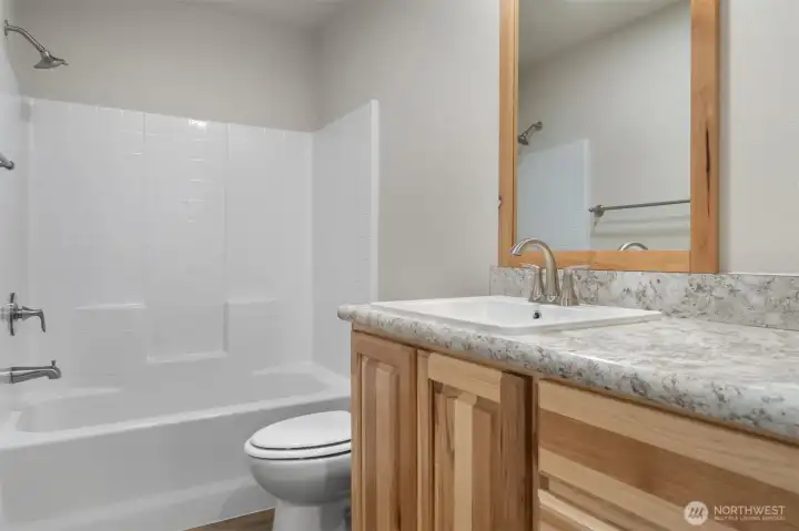 The first of two identical bathrooms