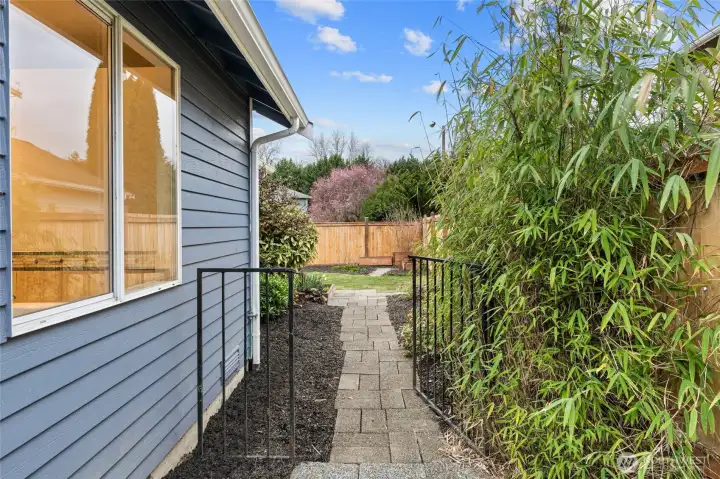 Rain Bird sprinkler system offers automated irrigation to keep the yard lush and easy to maintain.