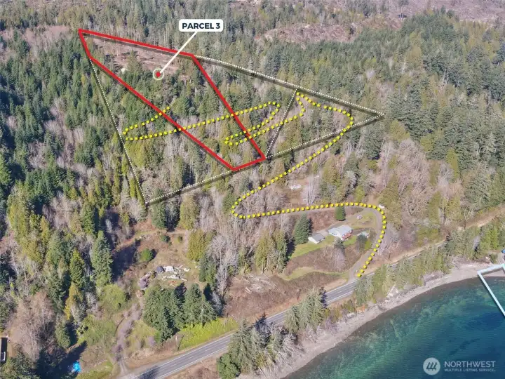 Overhead view with approximate boundaries of subject property in red and yellow dotted lines represents approximate access route.