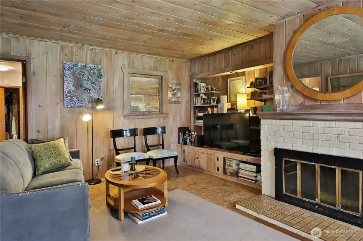 as well as entertainment! A built in storage and media cabinet sits next to the fireplace.