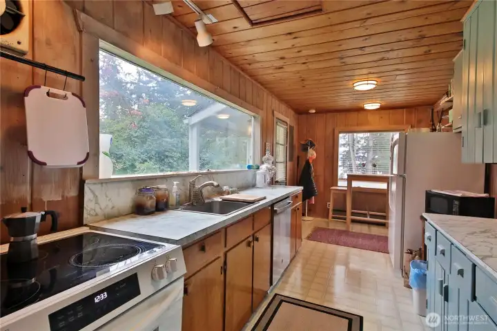 The large kitchen window fills the space with natural light.