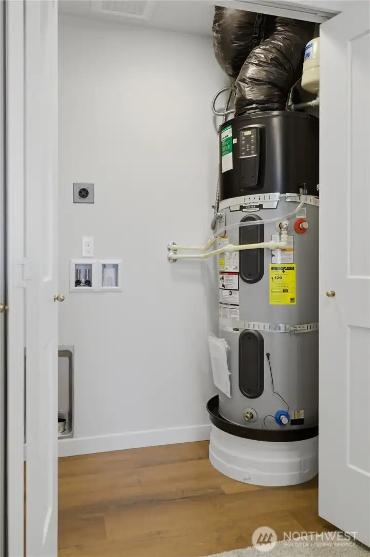 Dedicated laundry and mechanical closet with efficient layout Dedicated laundry and mechanical closet with efficient layout