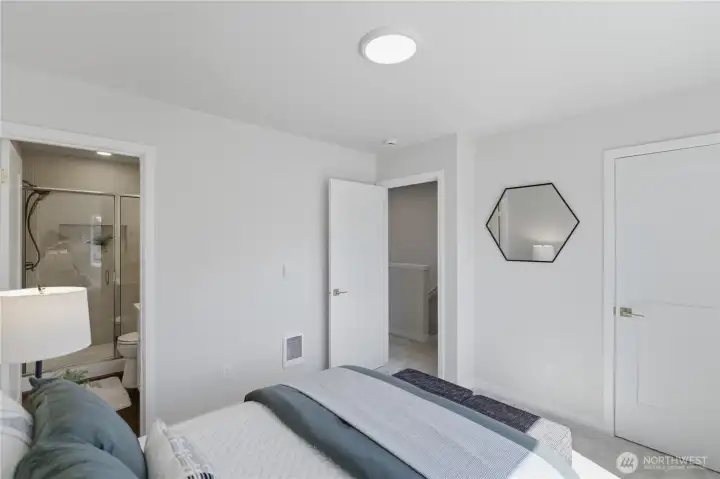 Primary suite with clean finishes and great natural light Primary suite with clean finishes and great natural light