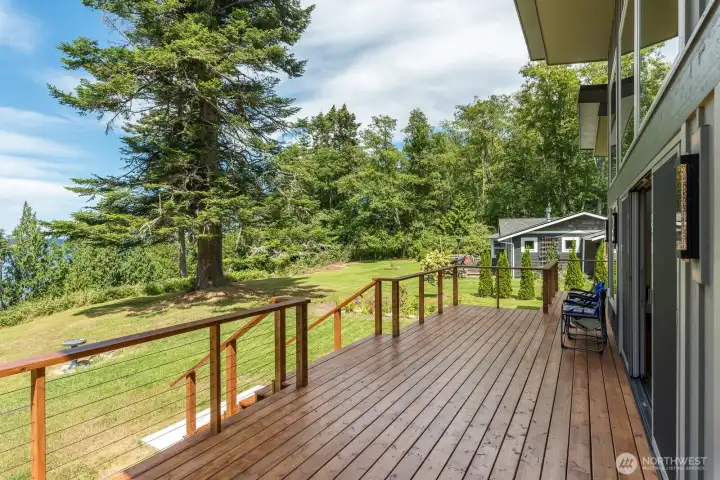Beautiful large Cedar deck with sail boat wire railing to enjoy the peaceful surroundings.