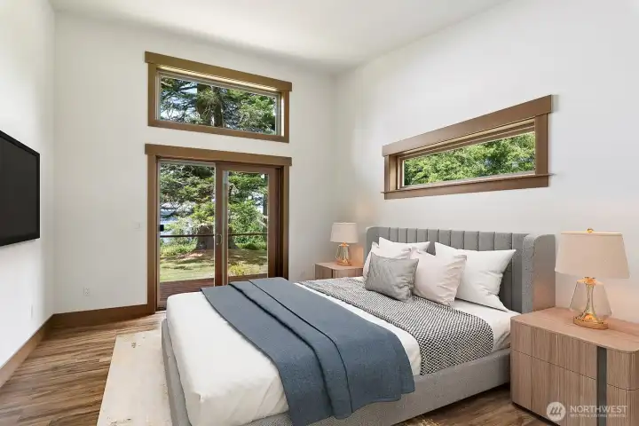 Primary Suite (virtually staged) with slider out to deck. NIce walk in closet too.