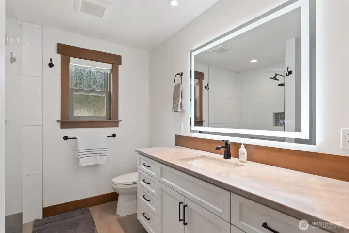 Primary bath with tile, radiant heat, & granite