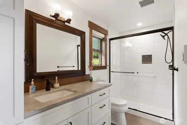 Guest bath with granite, tile, & radiant heat.