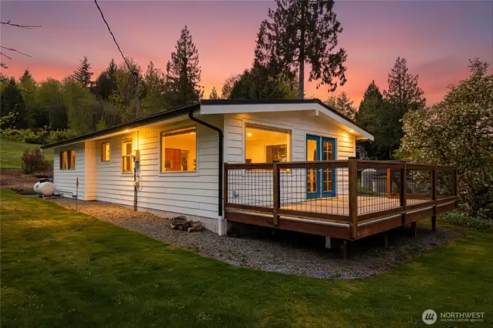 Enjoy sunny days and summer evenings on the large front deck! Enjoy sunny days and summer evenings on the large front deck!