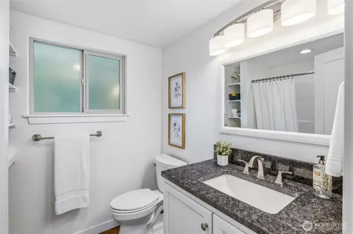 The full bathroom is directly adjacent to the primary bedroom. The full bathroom is directly adjacent to the primary bedroom.