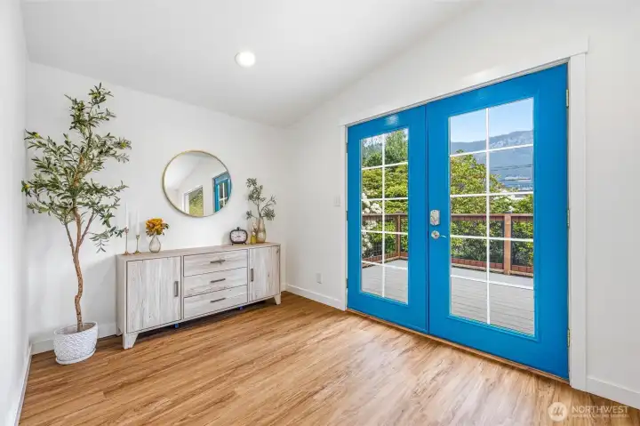 Beautiful french doors lead out to the large front Trex deck. Beautiful french doors lead out to the large front Trex deck.