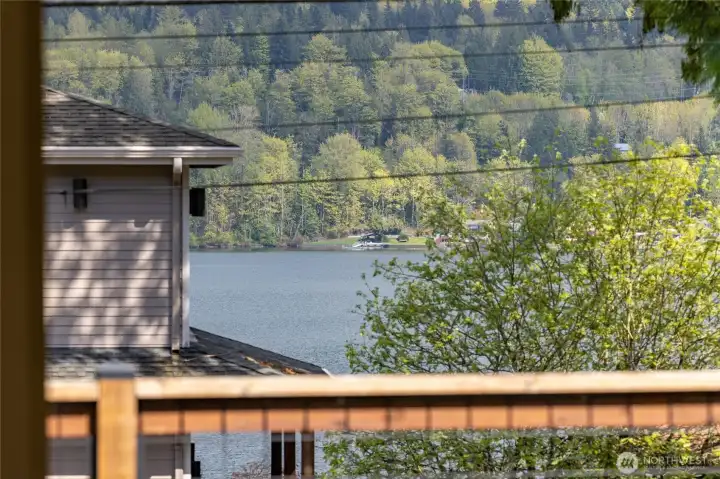 There is a peek-a-boo view of the lake from the front living room and deck. There is a peek-a-boo view of the lake from the front living room and deck.