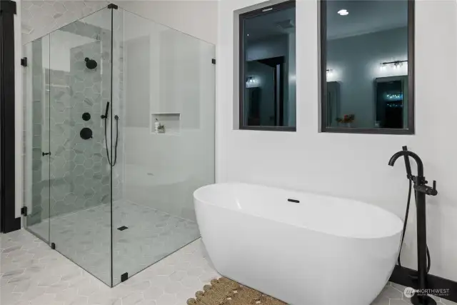 Curbless shower and deep soaking stand-alone tub.