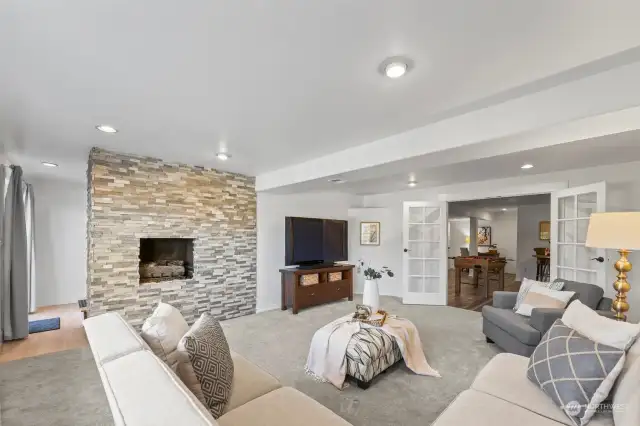Spacious family room with gas fireplace offers plenty of space.  The fourth bedroom/bonus room is adjacent.  Add blinds or curtains for privacy.