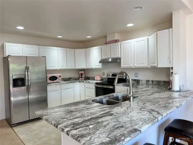 Kitchen with new granite countertops