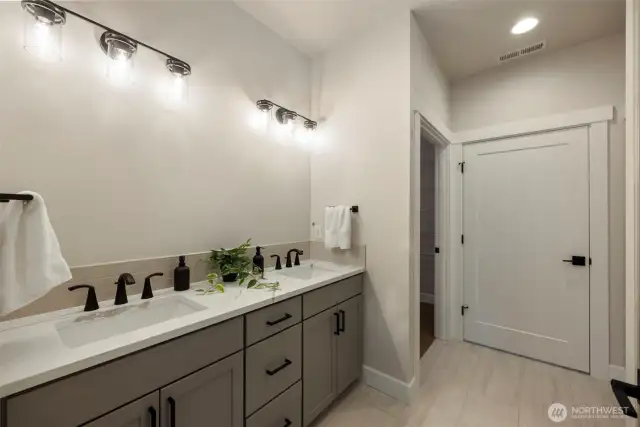 Primary on-suite - *Former Sinclair floor plan. Garage left. Finishes may vary.