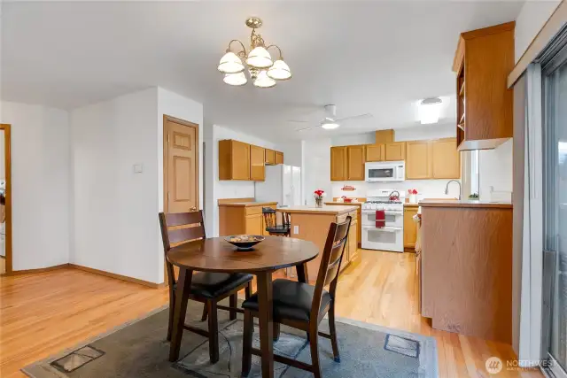 The hall to the left here leads to the laundry room and 1/2 bath. All real hardwood floors in this area of the home.