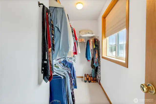 Walk in closet in the primary suite includes a window for extra light!