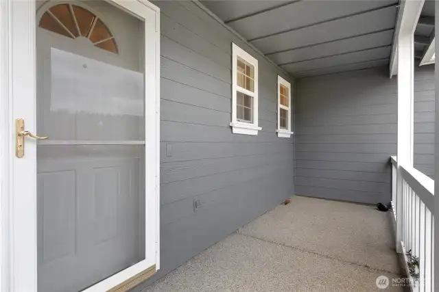 Wonderful covered front porch is so inviting and keeps you and your guests dry!