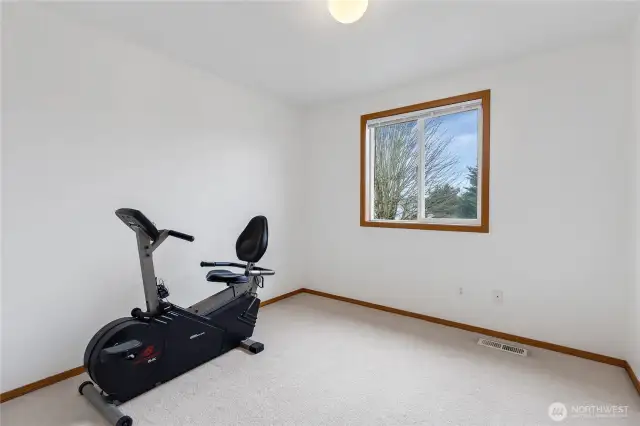 This is an upstairs office that also overlooks the peaceful backyard