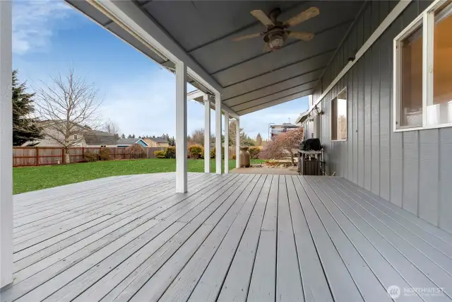 This is the wonderful covered deck and patio area. Relax and Bbq no matter what the weather is! You have neighbors in this lovely community but no one too close crowding your space or looking over your backyard!