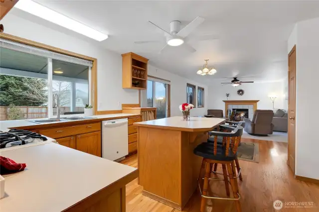 This shot of the kitchen looking toward the spacious family room has large windows all the way down for an abundance of light.