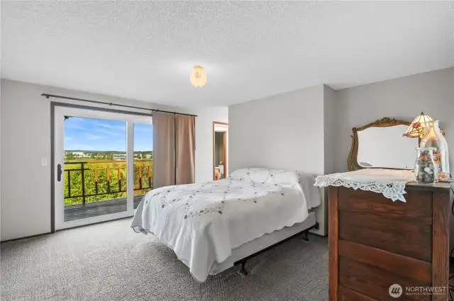 Primary bedroom with sliding door to wrap around deck.
