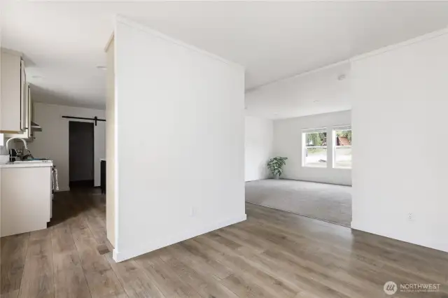 Dining room is open to the Kitchen, so perfect for entertaining, and Living room.  To the left before entering the kitchen is the back door.