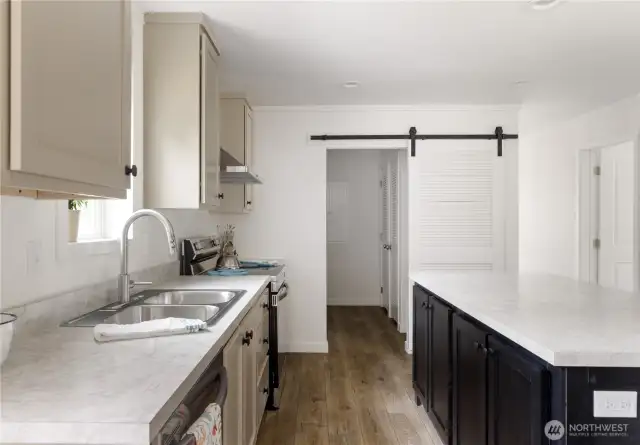Better look at the Barn door and mechanical closet.  Washer and Dryer hook ups are opposite that closet
