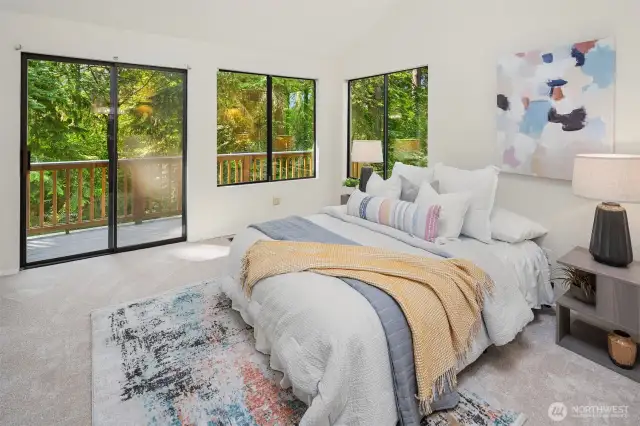 Primary bedroom with its own private balcony.