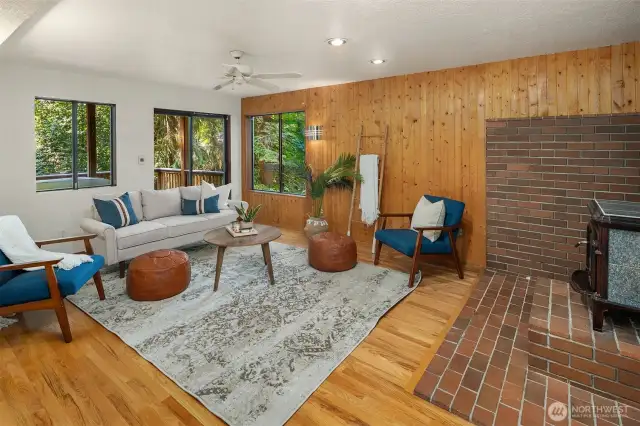 Basement living room with wood burning stove.