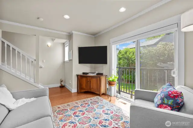 Living area opens up to a darling Juliet balcony.