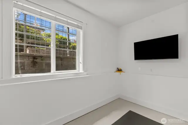 Office/den/exercise room on the entry level features a nice big window.
