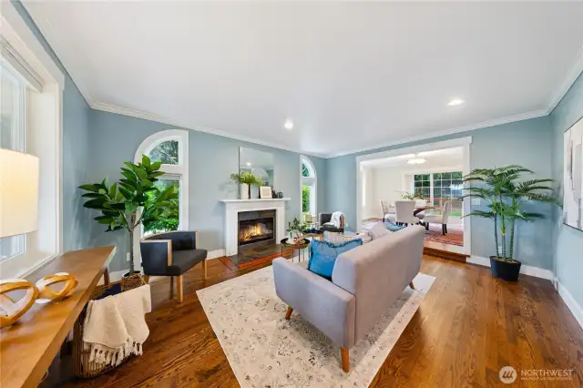 Wonderful living room with wood-burning fireplace and oak flooring.