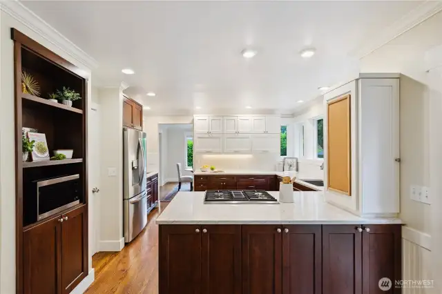 Another view of the kitchen shows lots of storage, and easy access to the formal dining as well as the casual eating space.