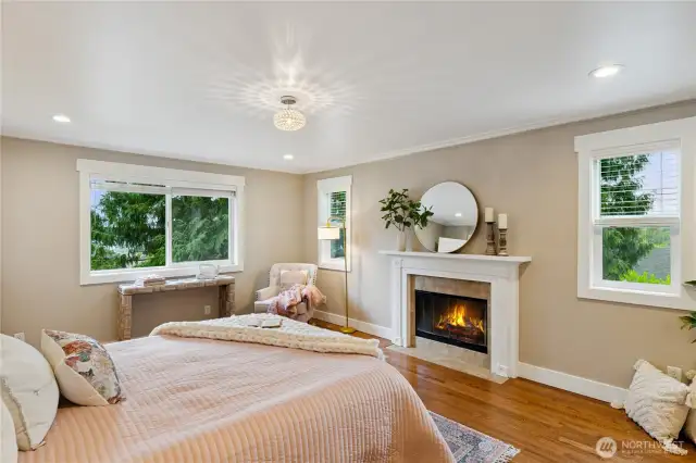 Very spacious primary bedroom with wood-burning fireplace and walk-in closet.