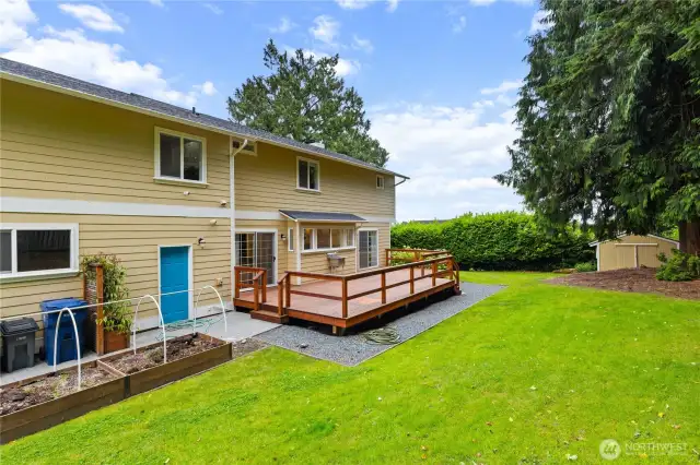 Backyard with deck and garden space.