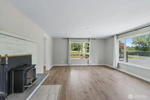 Bright living room w/wood stove insert