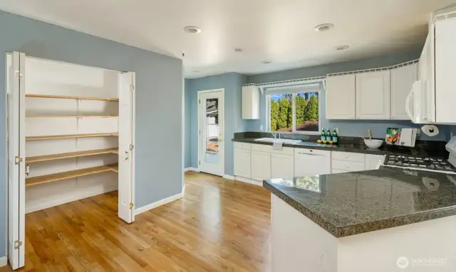 Expansive pantry. Entry to peaceful backyard