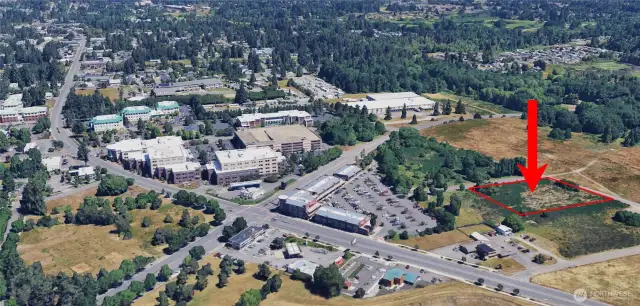 The red arrow and red line outlining the property line are superimposed onto this image.