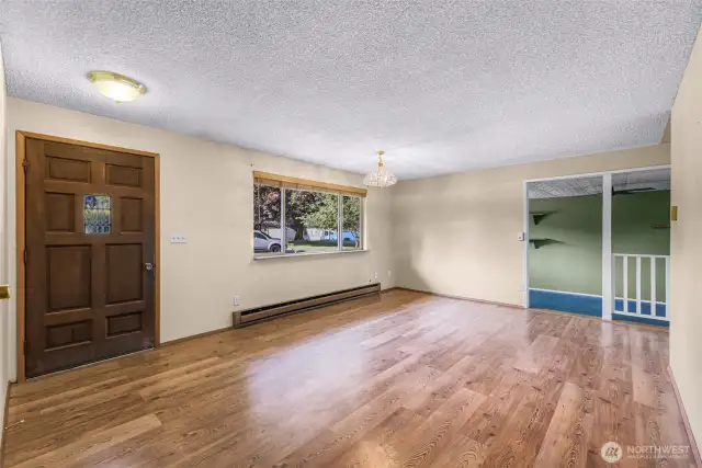 Main entry opens into large bright living room