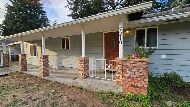 Front porch with brick accents